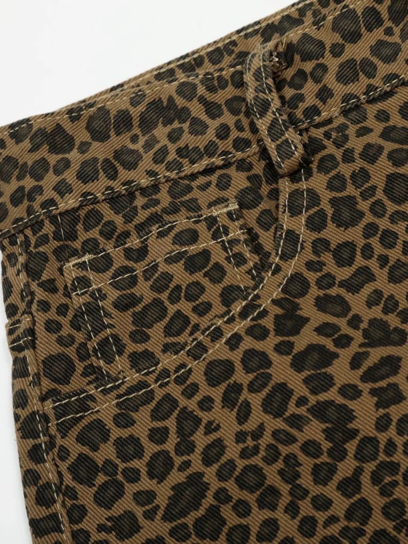 Men's leopard print wide-leg capris by Trendsi featuring a bold leopard pattern and relaxed fit, suitable for casual or trendy outfits.
