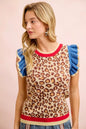 Red and blue leopard print knit top with ruffled details from BiBi for 4th of July, featuring trendy, festive style.