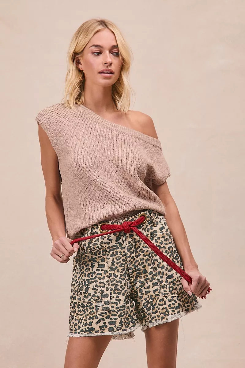 Leopard print shorts by Trendsi featuring a braided waist belt and patch pockets, designed for a stylish, casual look.