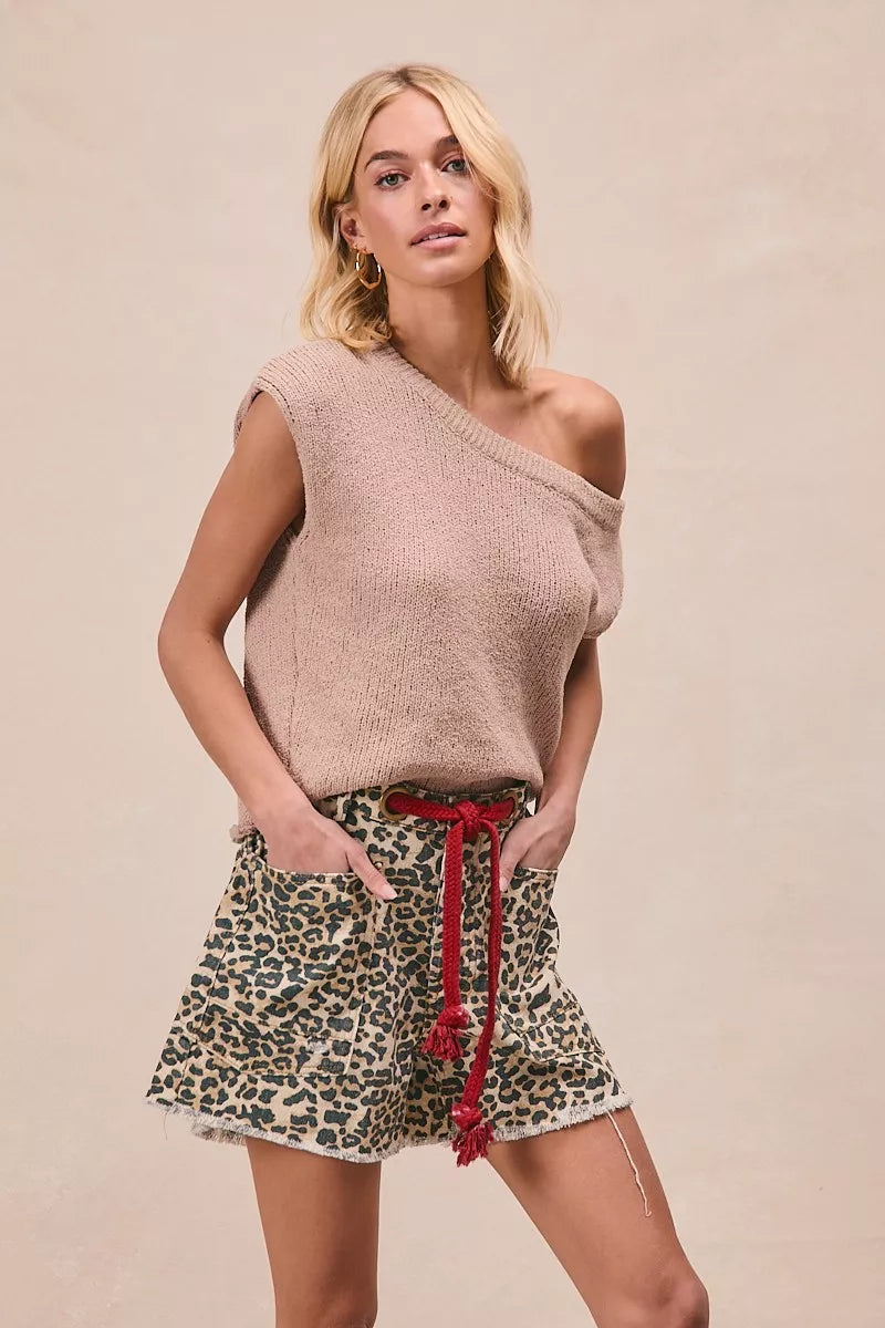 Leopard print shorts with patch pockets, featuring a braided waist belt, styled by Trendsi for a trendy, casual look.