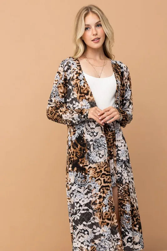 Leopard print kimono and shorts set by Trendsi featuring animal print fabric, lightweight design, and relaxed fit for casual wear.