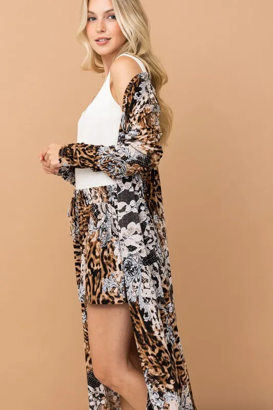 Leopard print kimono and shorts set by Trendsi, featuring animal print fabric, flowing kimono, and matching shorts for a stylish look.