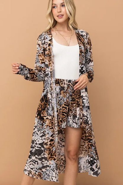 Leopard print kimono and shorts set by Trendsi, featuring animal print fabric, styled for a casual, trendy look.