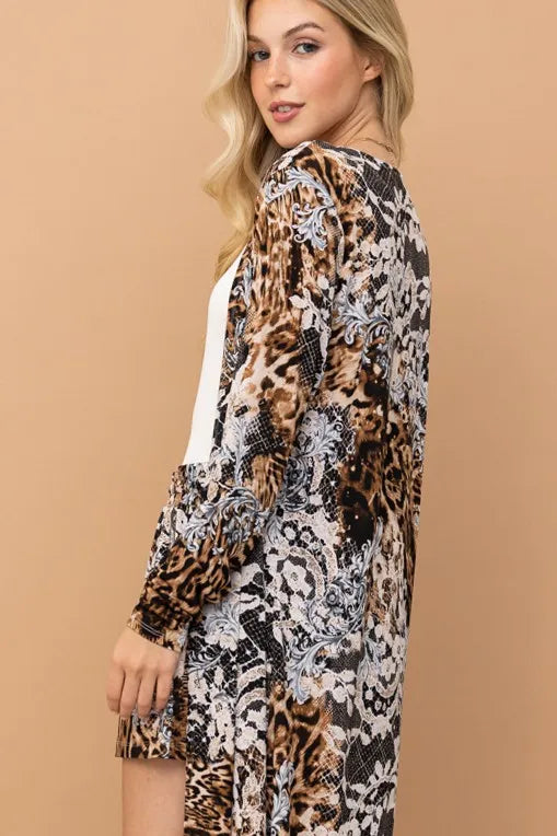 Leopard print kimono and shorts set by Trendsi featuring animal print fabric, lightweight kimono with matching shorts, stylish and comfortable.