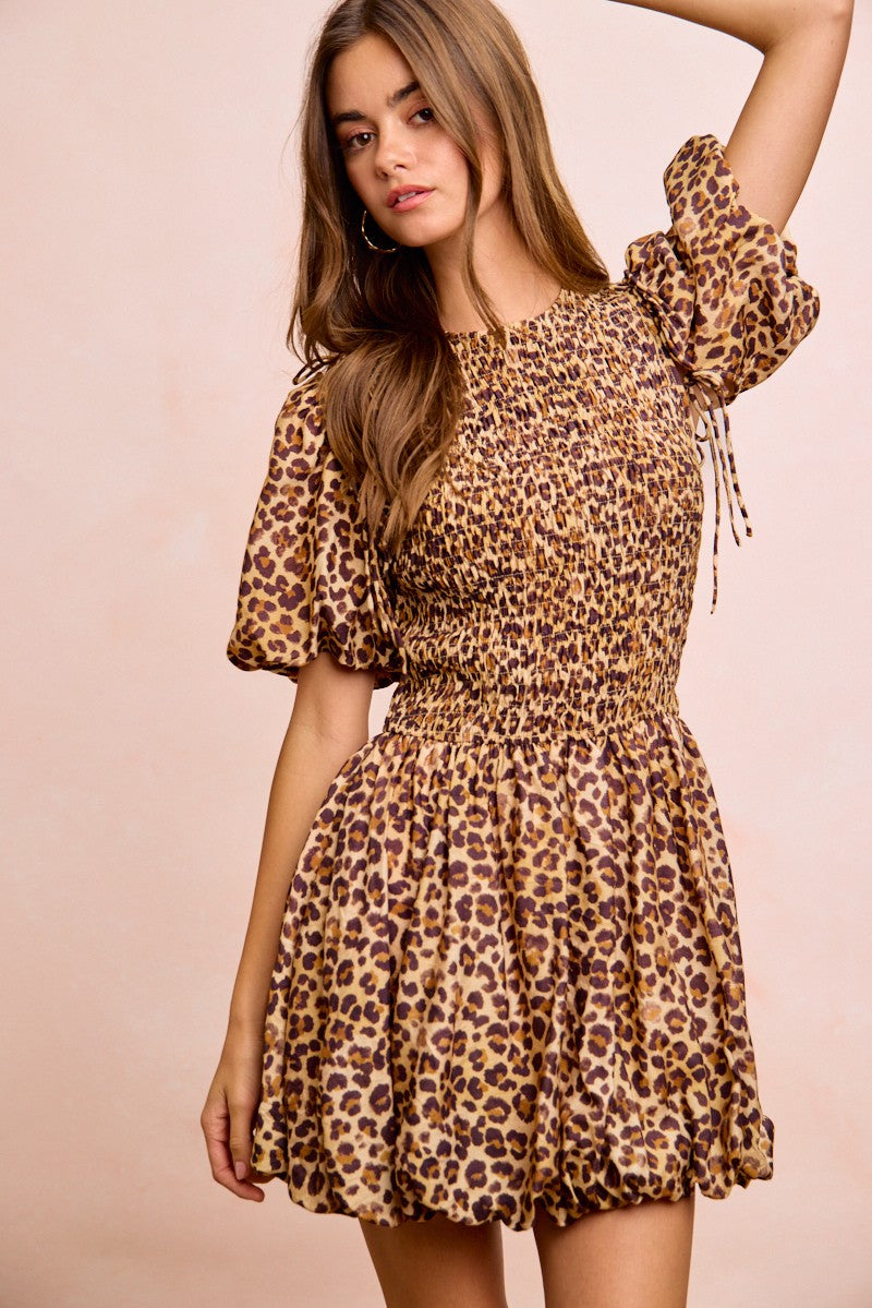 Trendsi BiBi Leopard bow tie puff sleeves dress showcasing leopard print fabric and stylish puffed sleeves for a fashionable look.