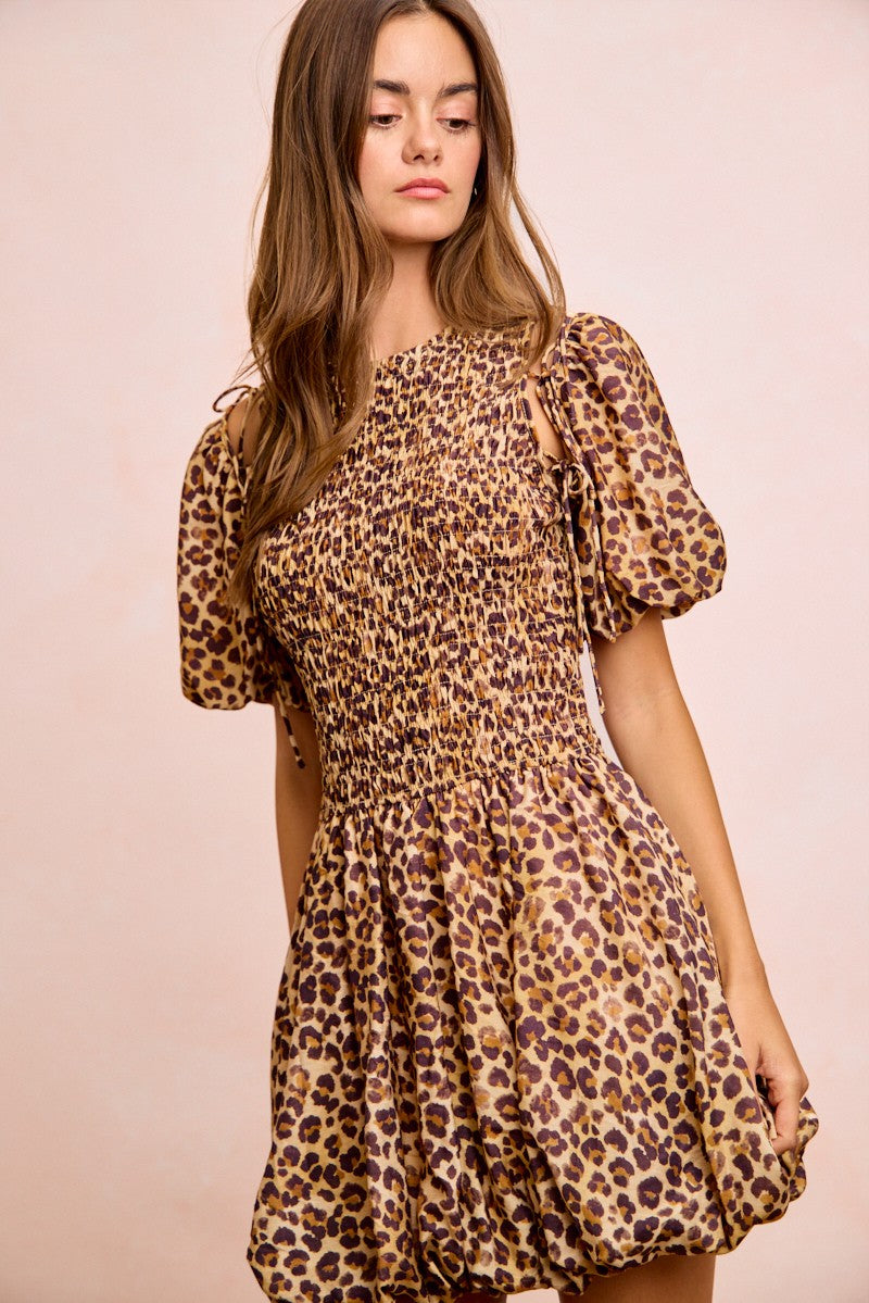 Trendsi BiBi Leopard bow tie dress with attachable puff sleeves, featuring a stylish leopard print and elegant design.