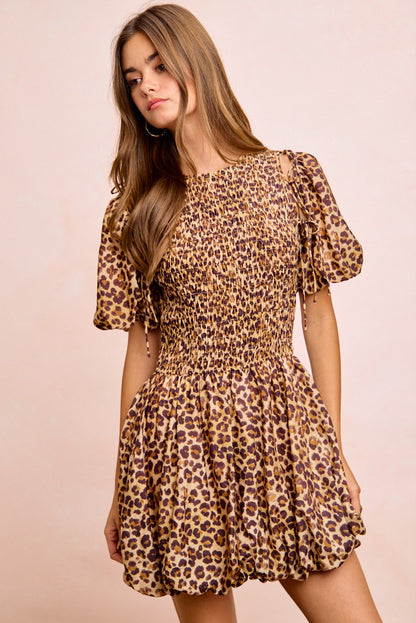 Trendsi BiBi leopard print dress with bow tie detail, attachable puff sleeves, and a stylish, feminine silhouette.