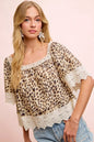 Leopard print lace trim square neckline top by Trendsi, featuring a mix of leopard patterns and long sleeves.