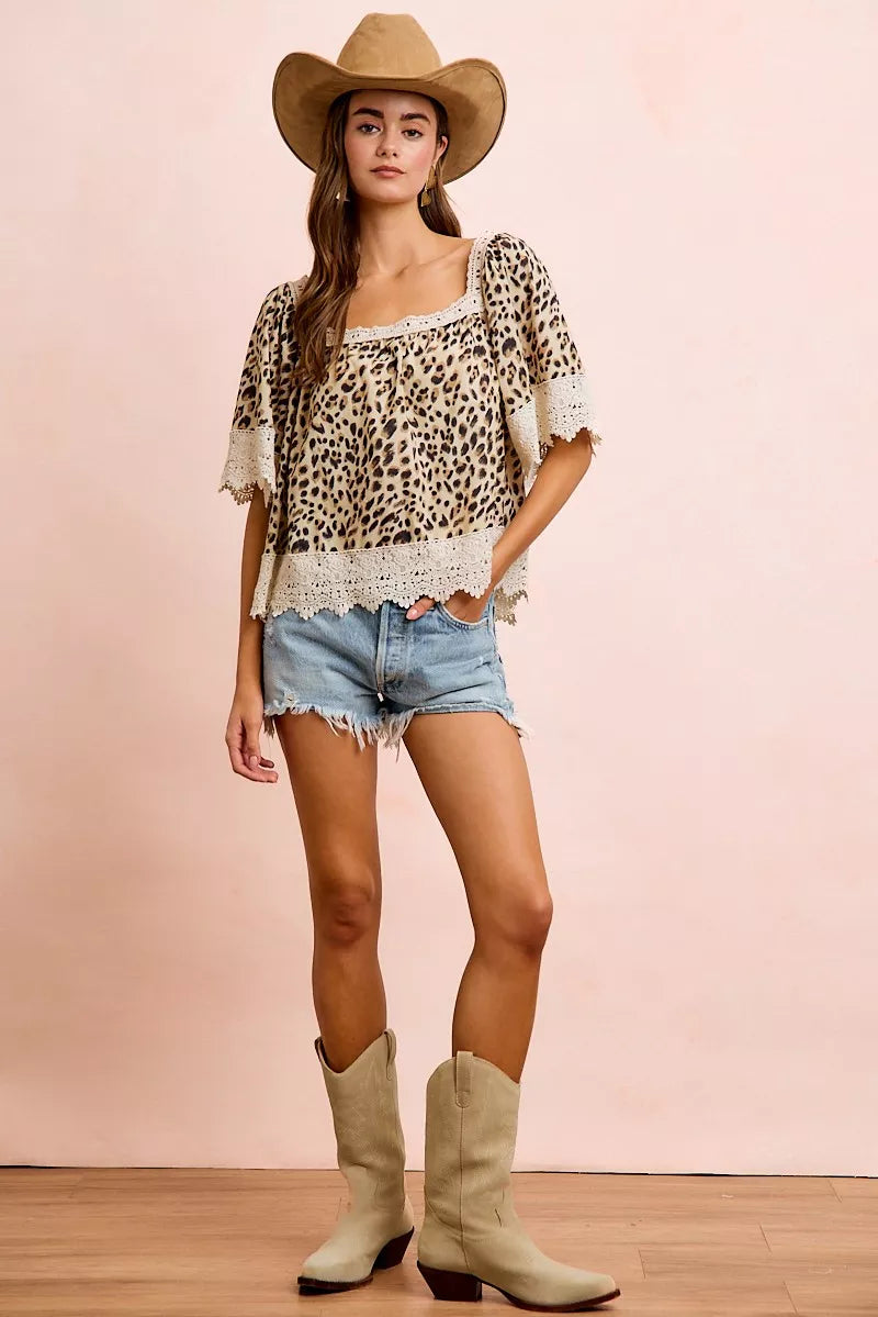 Leopard print lace-up square neckline top from BiBi by Trendsi with mixed animal print details and long sleeves.