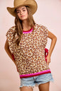 Leopard print side-tied sweater vest top from Trendsi featuring a stylish, fitted design and cozy knit fabric.