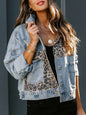 Distressed leopard print drop shoulder denim jacket from Trendsi, featuring a stylish and casual design with a relaxed fit.