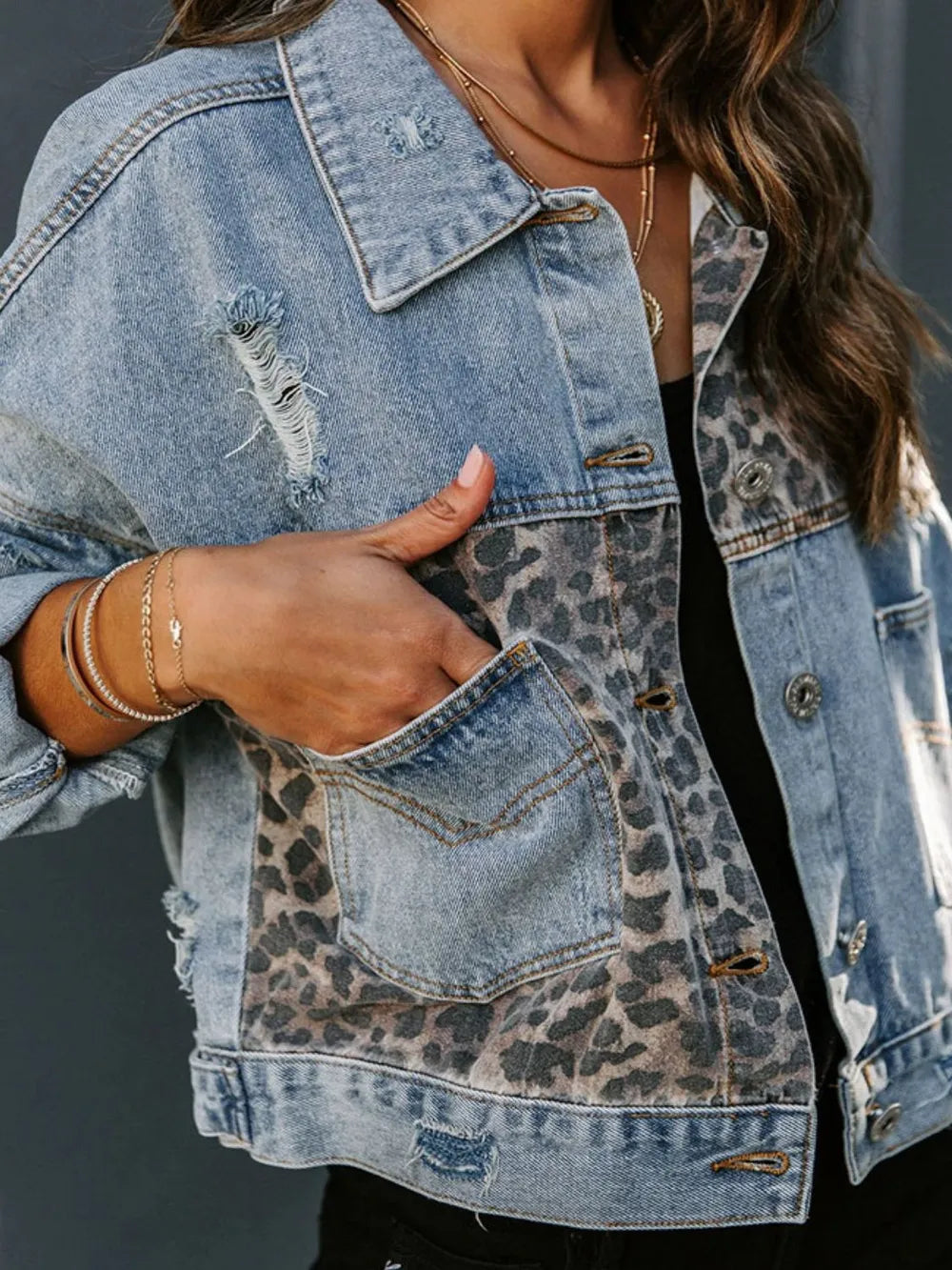 Distressed leopard print drop shoulder denim jacket from Trendsi with a relaxed fit and casual style.