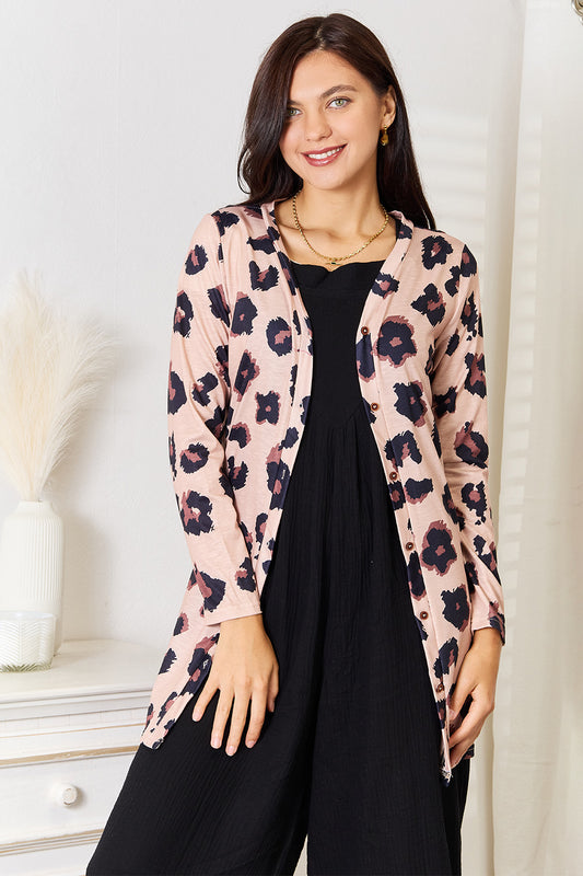 Leopard print double take printed button-front longline cardigan by Trendsi, featuring a cozy, stylish design and relaxed fit.