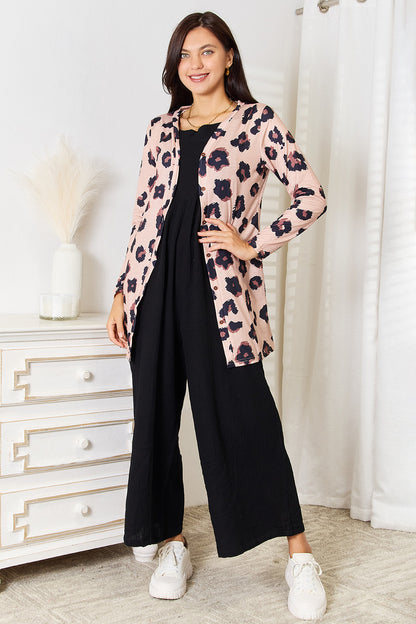 Leopard print double take printed longline cardigan with button front from Trendsi, styled with sleeves and open front detail.