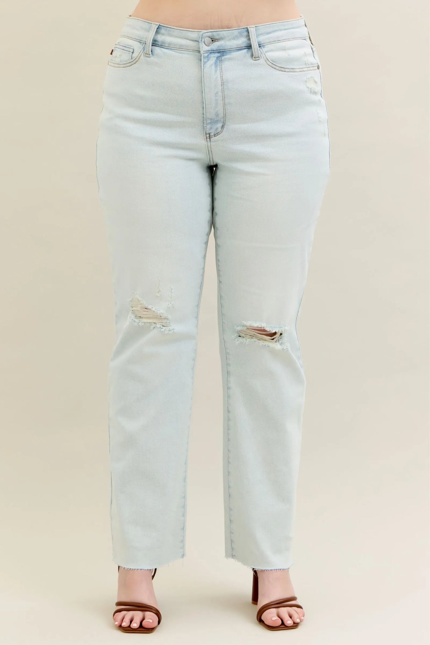 Plus size Judy Blue destroy and fray hem bootcut jeans with distressed details and classic fit, shown in a full-length image.
