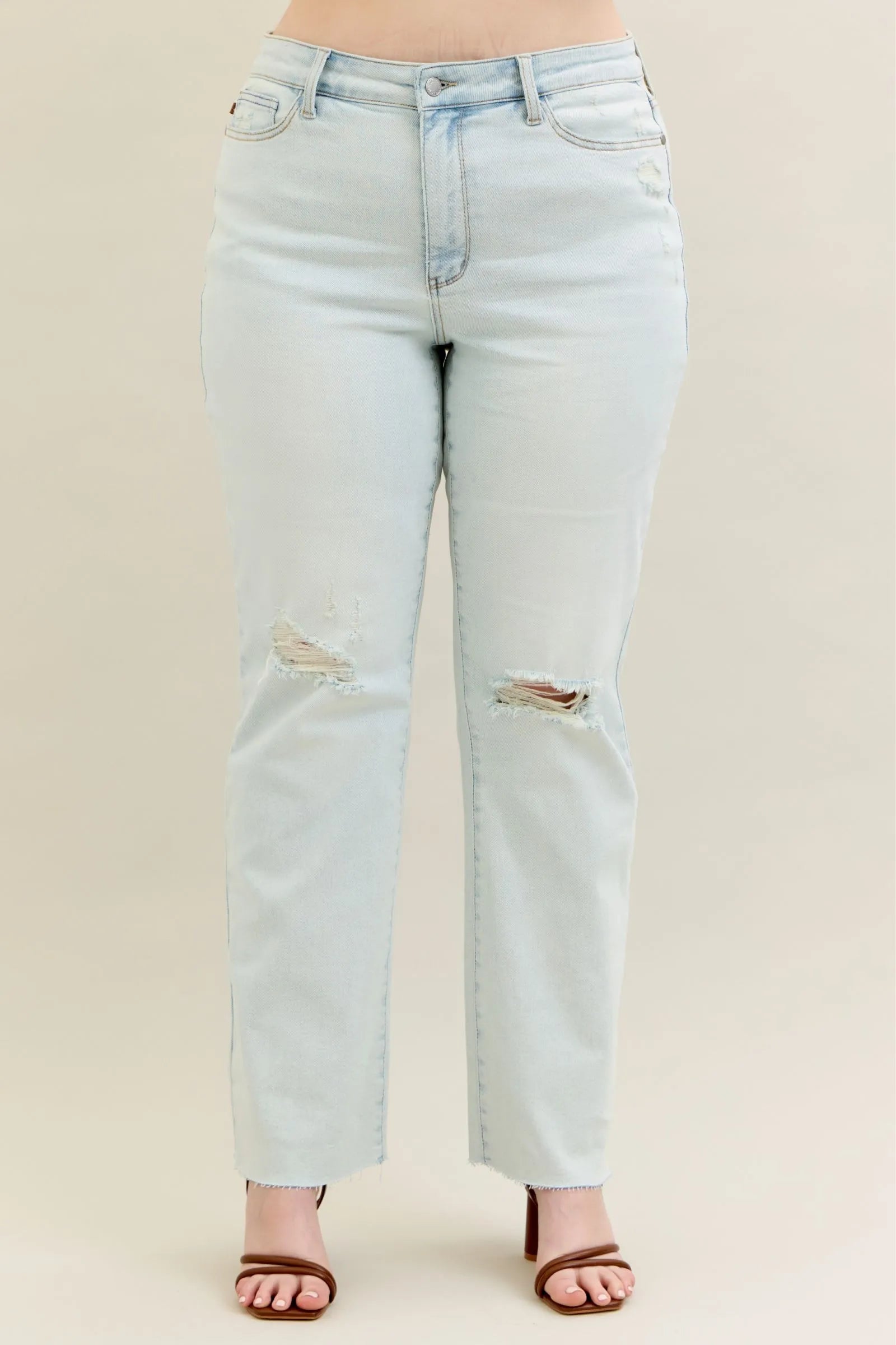 Plus size Judy Blue destroy and fray hem bootcut jeans with distressed details and classic fit, shown in a full-length image.