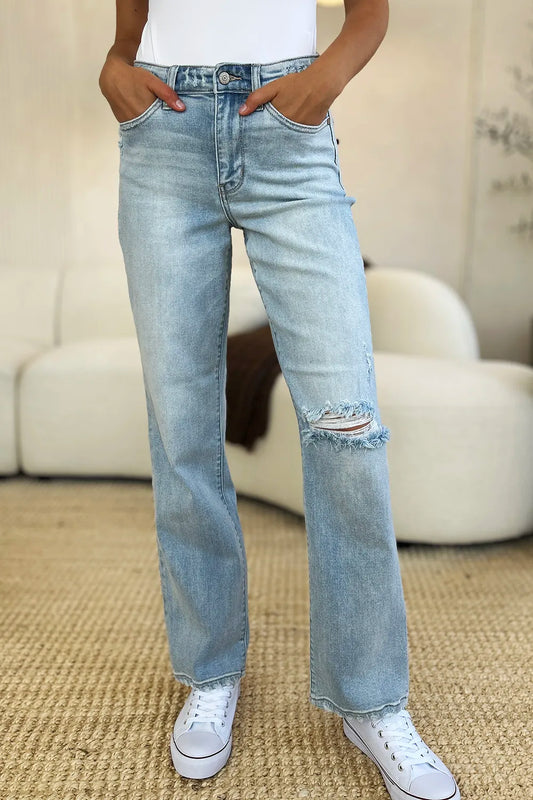Light wash Judy Blue high waist distressed straight jeans with frayed hems and ripped details, displayed on a model.