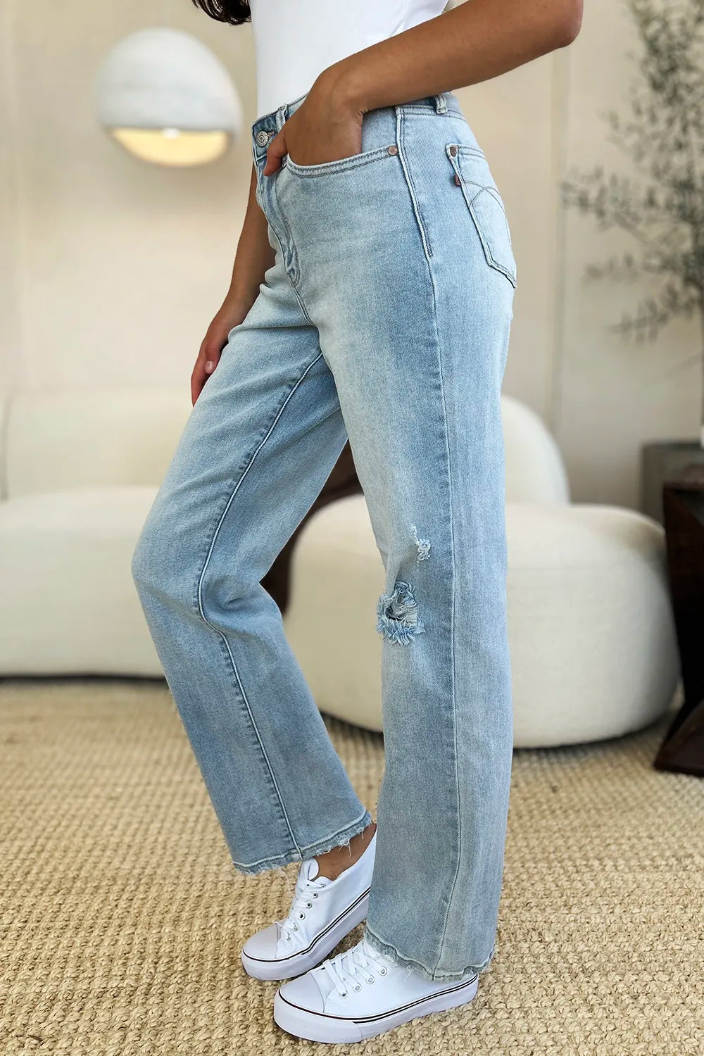 Light blue Judy Blue high waist distressed straight jeans with rips and frayed hems, full size, on a neutral background.