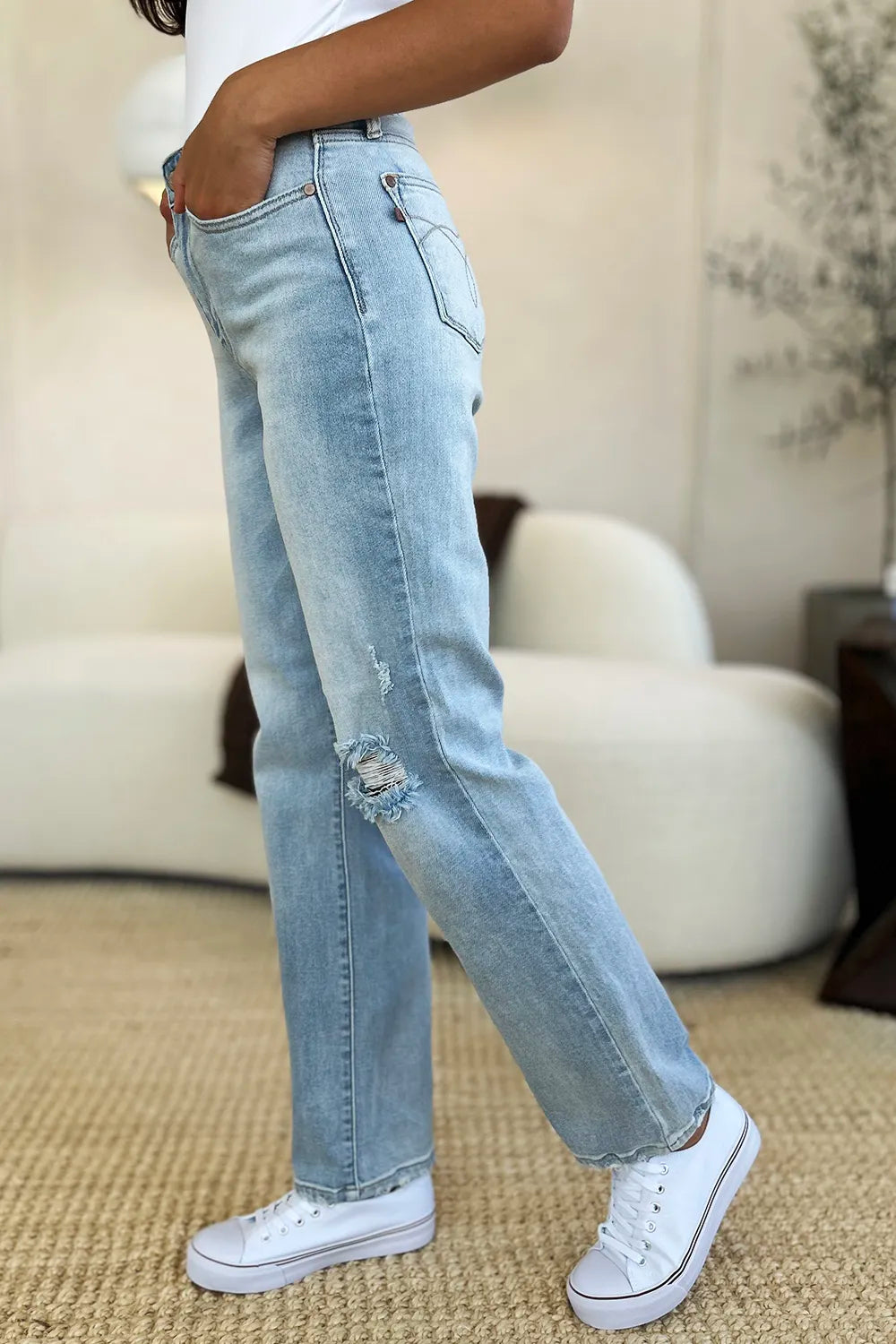 Light wash Judy Blue high waist distressed straight jeans with frayed hems and classic five-pocket design.