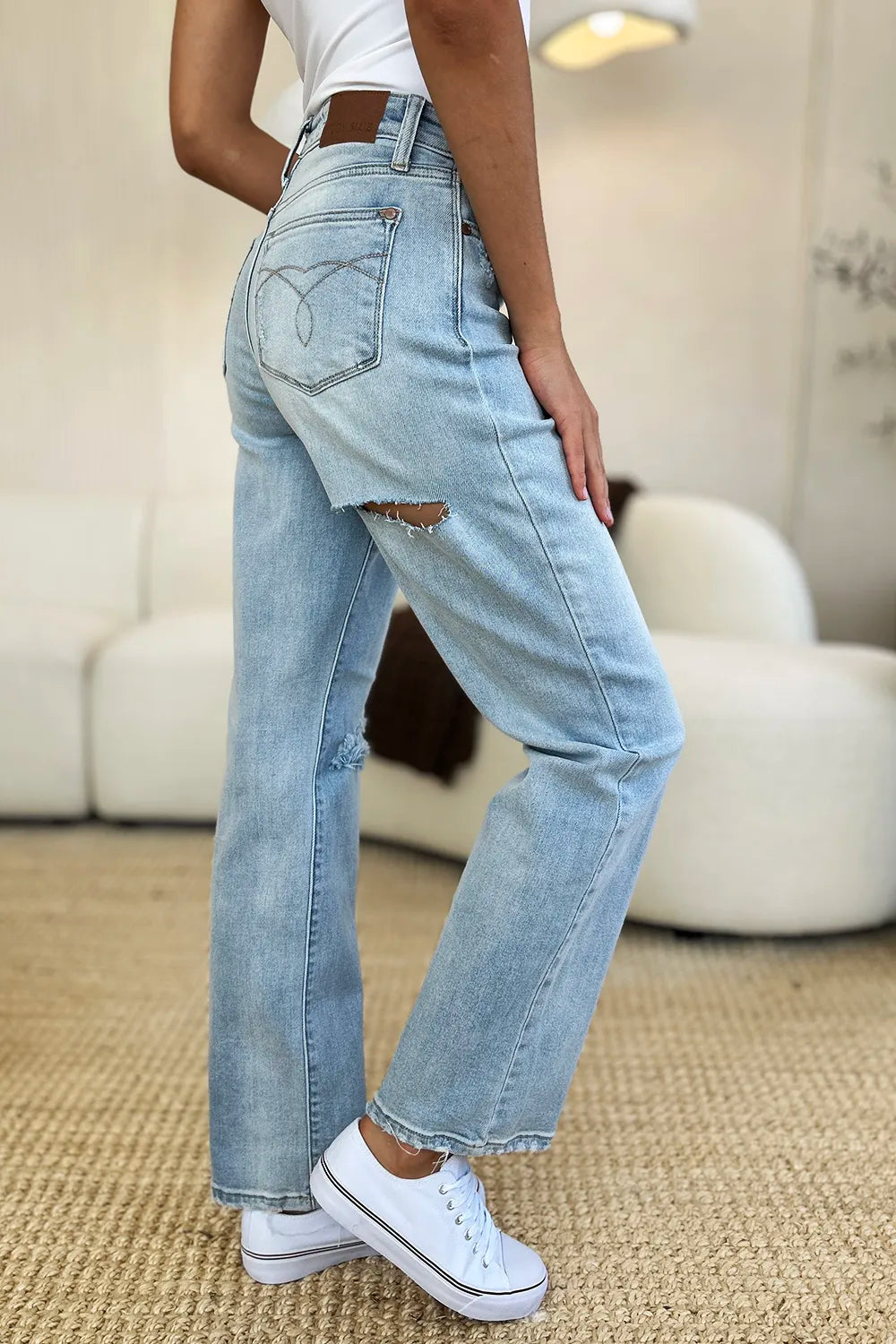 Light wash Judy Blue high waist distressed straight jeans with frayed hems and classic five-pocket design.