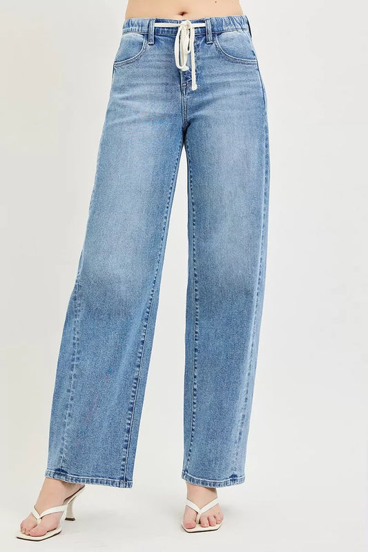 Light blue RISEN relaxed fit drawstring waist jeans with front pockets and casual style, ideal for everyday wear.