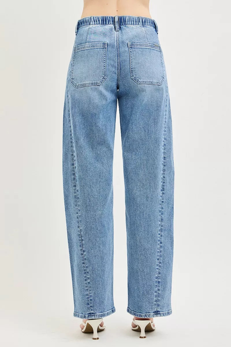 Light blue RISEN relaxed fit jeans with drawstring waist, featuring a casual style and classic denim look.