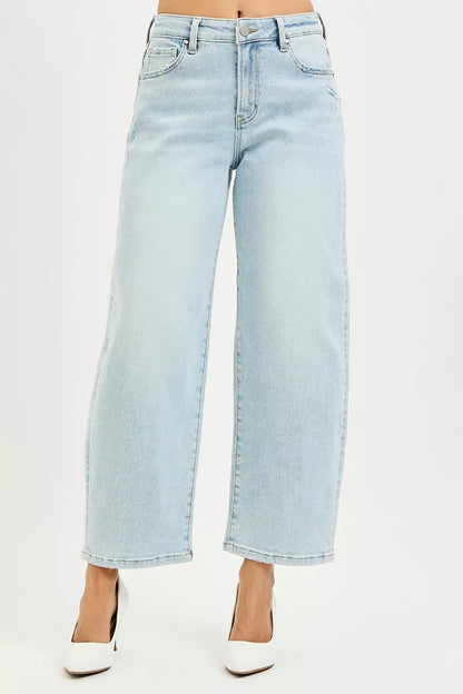 Light blue RISEN high-rise crop barrel jeans from Trendsi, showing the relaxed fit and stylish rolled hems.