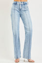 Light blue RISEN Tummy Control High Rise Straight Pin Tuck Jeans with front and back pockets on a white background.