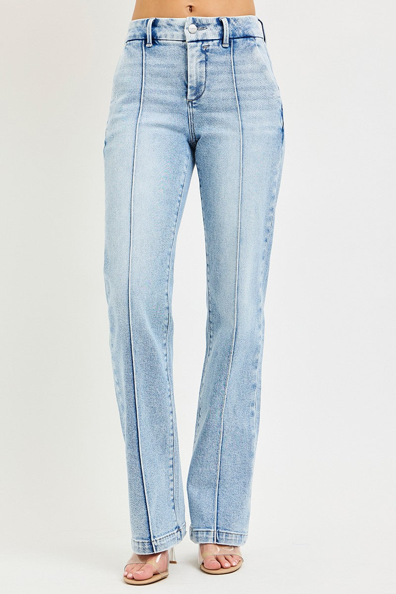 Light wash Risen Tummy Control High Rise Straight Jeans with pin tuck detailing, shown on a model.