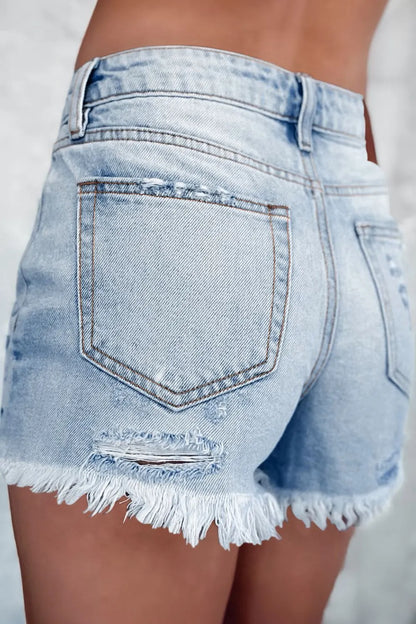 Light blue distressed raw hem high waist denim shorts from Trendsi, featuring a casual fit and stylish raw hem detail.