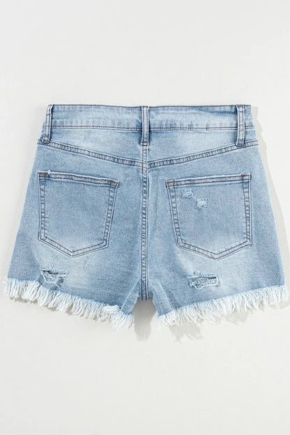 Light blue distressed raw hem high waist denim shorts from Trendsi, showcasing a casual summer style.