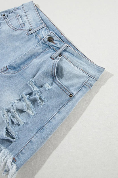Light blue distressed raw hem high waist denim shorts from Trendsi featuring a casual fit and trendy distressed details.