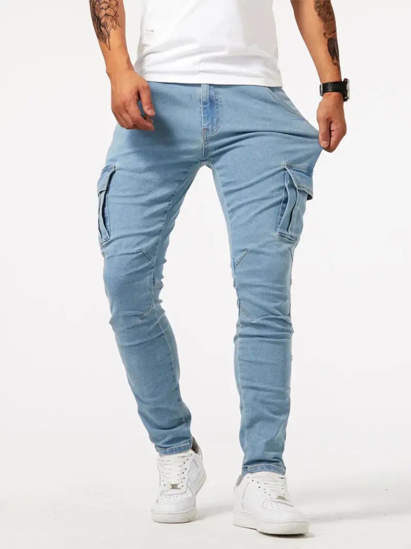 Light blue men's plus size skinny cargo jeans from Trendsi, featuring a slim fit with multiple cargo pockets.
