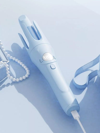Light blue automatic rotating ceramic curling iron by Trendsi, showcasing its sleek design and rotating barrel for easy styling.