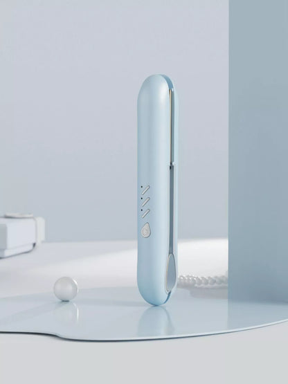 Light blue Trendsi fast heating hair straightener with sleek design and ceramic plates for smooth, straight hair styling.