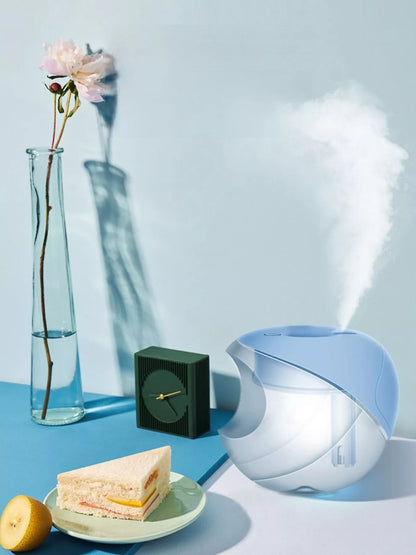 Light blue Apple-Shaped Humidifier by Trendsi, compact and decorative with a smooth apple design, ideal for adding moisture to rooms.