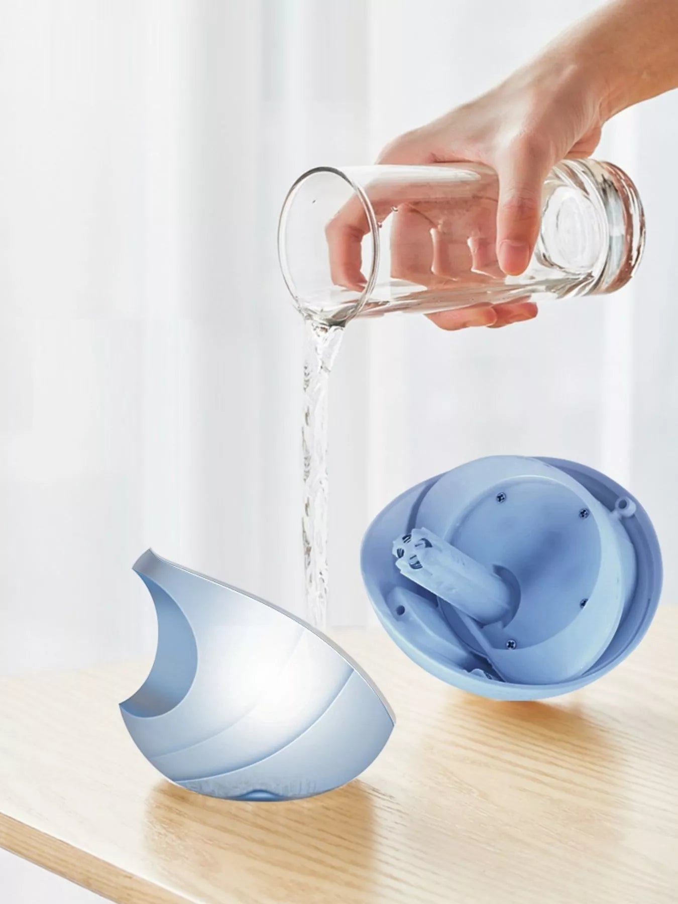 Light blue apple-shaped humidifier from Trendsi, showing its compact design and smooth surface.