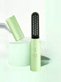 Light blue portable heated straightening comb by Trendsi, compact and ready for easy hair styling on the go.