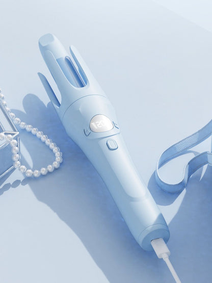 Light blue rotating ceramic hair curling iron from Trendsi with adjustable temperature and ergonomic handle.