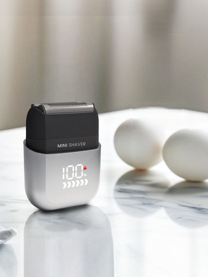 Light blue waterproof electric shaver by Trendsi with a sleek design, suitable for wet and dry shaving.