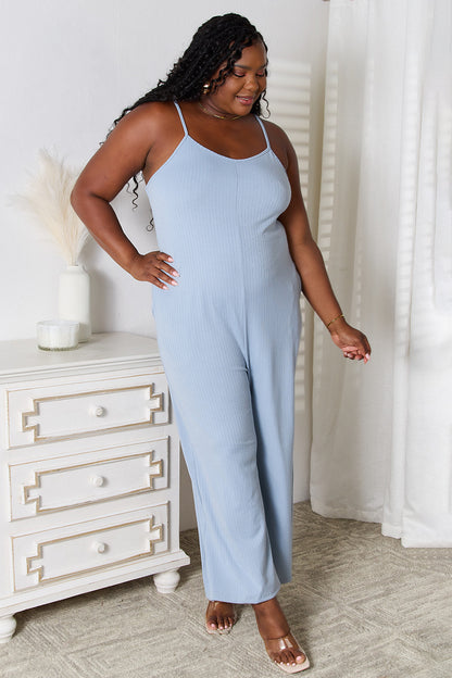 Light blue Trendsi Basic Bae full-size spaghetti strap V-neck jumpsuit hanging on a white background.