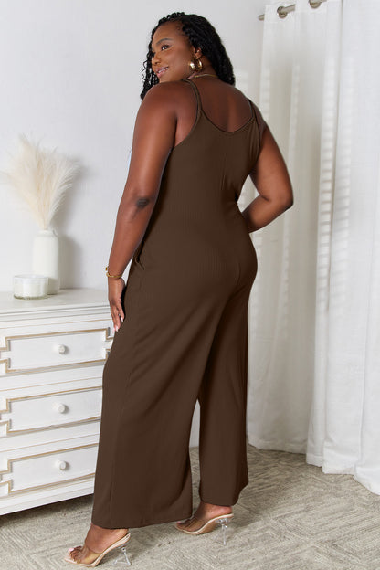 Light blue Basic Bae full-size spaghetti strap V-neck jumpsuit by Trendsi, featuring a relaxed fit and casual style.