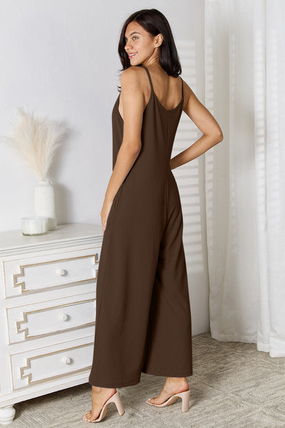 Light blue Trendsi Basic Bae full-size spaghetti strap V-neck jumpsuit shown on a model. Comfortable, stylish casual wear.
