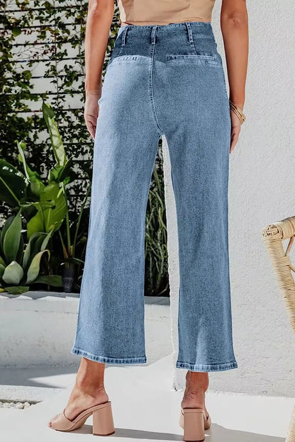 Light blue button fly cropped wide-leg jeans from Trendsi with a relaxed fit and high waist, shown on a model.