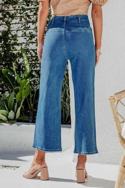Light blue button fly cropped wide-leg jeans from Trendsi, showing high-waisted style and relaxed fit with front pockets.