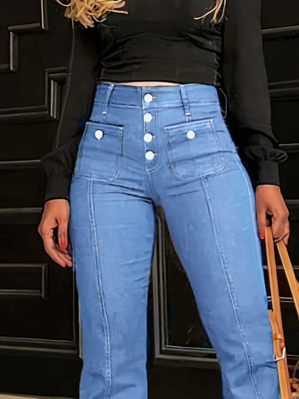 Light blue high waist flare jeans with button fly from Trendsi, featuring a classic denim design and wide-leg style.