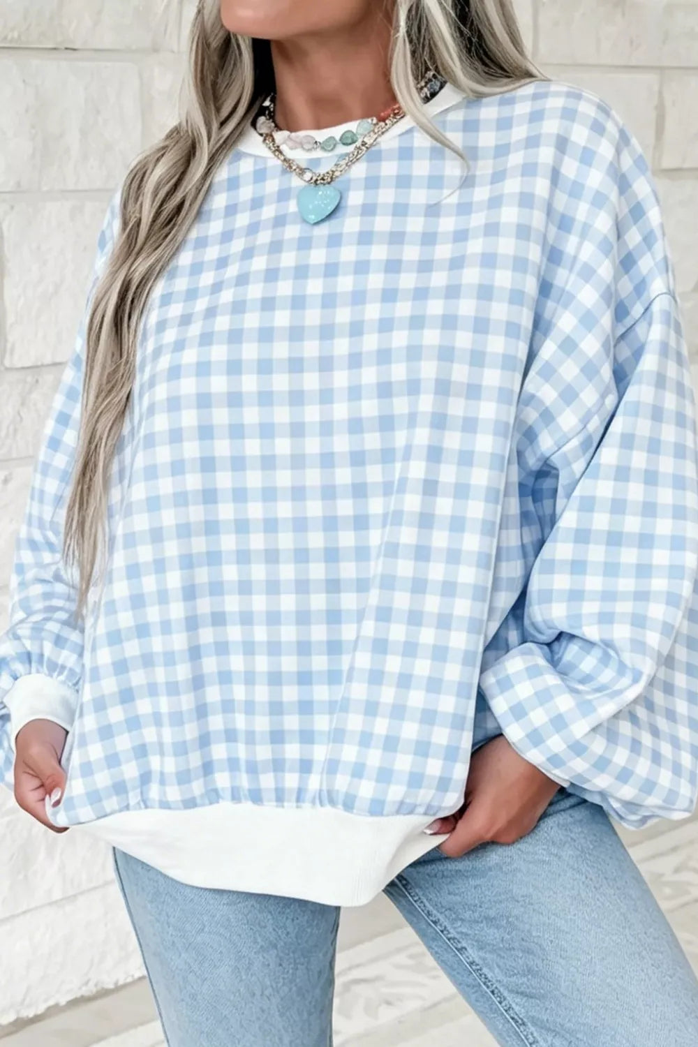 Light blue casual plaid dropped shoulder sweatshirt by Trendsi with relaxed fit and cozy design, perfect for casual wear.
