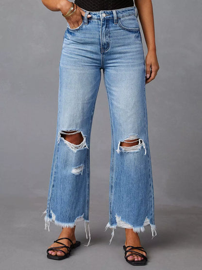 Light blue distressed raw hem jeans with front and back pockets from Trendsi, casual denim with a trendy, worn-in look.
