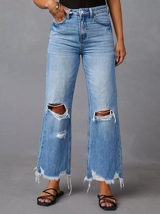 Light blue distressed raw hem jeans with front and back pockets from Trendsi, casual denim with a trendy, worn-in look.