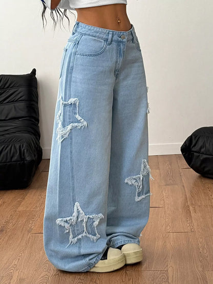 Light blue distressed star patch wide-leg jeans from Trendsi, featuring a relaxed fit and trendy vintage-inspired design.